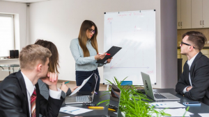 Team of professionals discussing operational risk management and compliance strategies using Veritiq ARC software framework